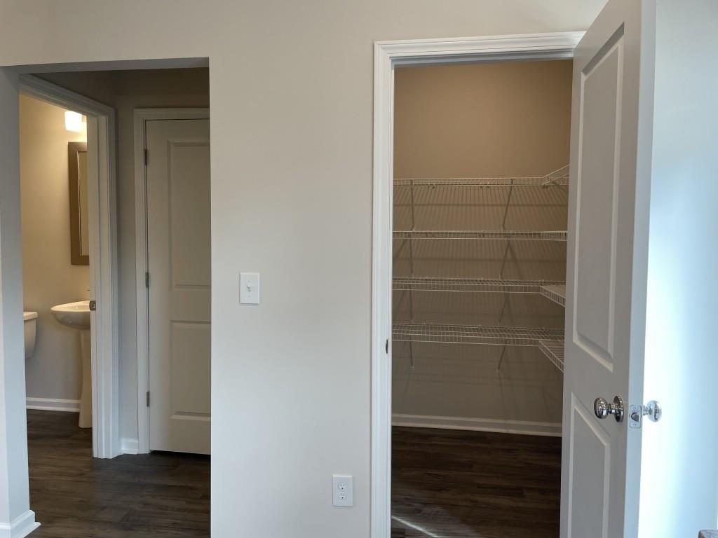 3400 Reagan Way Lawrenceville, GA 30044 - Photo 12 of 20 a view of walk in closet with wooden floor