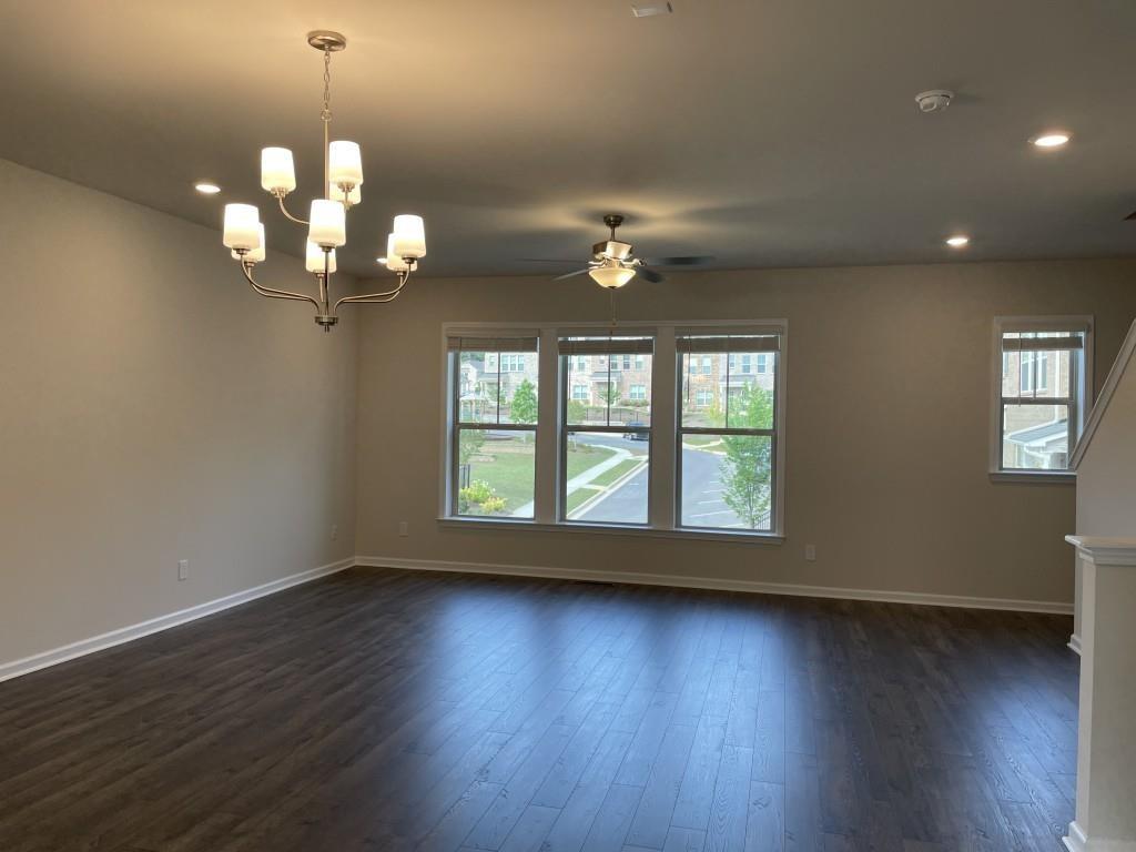 3400 Reagan Way Lawrenceville, GA 30044 - Photo 6 of 20 a view of a room with wooden floor and chandelier