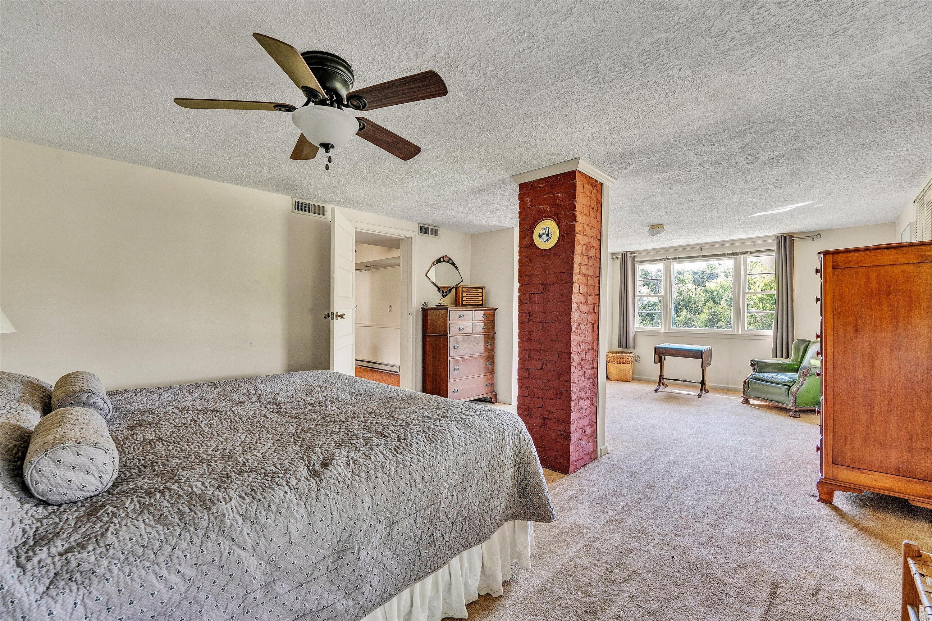 5328 White House Road Moneta, VA 24121 - Photo 14 of 39 a bed room with a bed and a ceiling fan