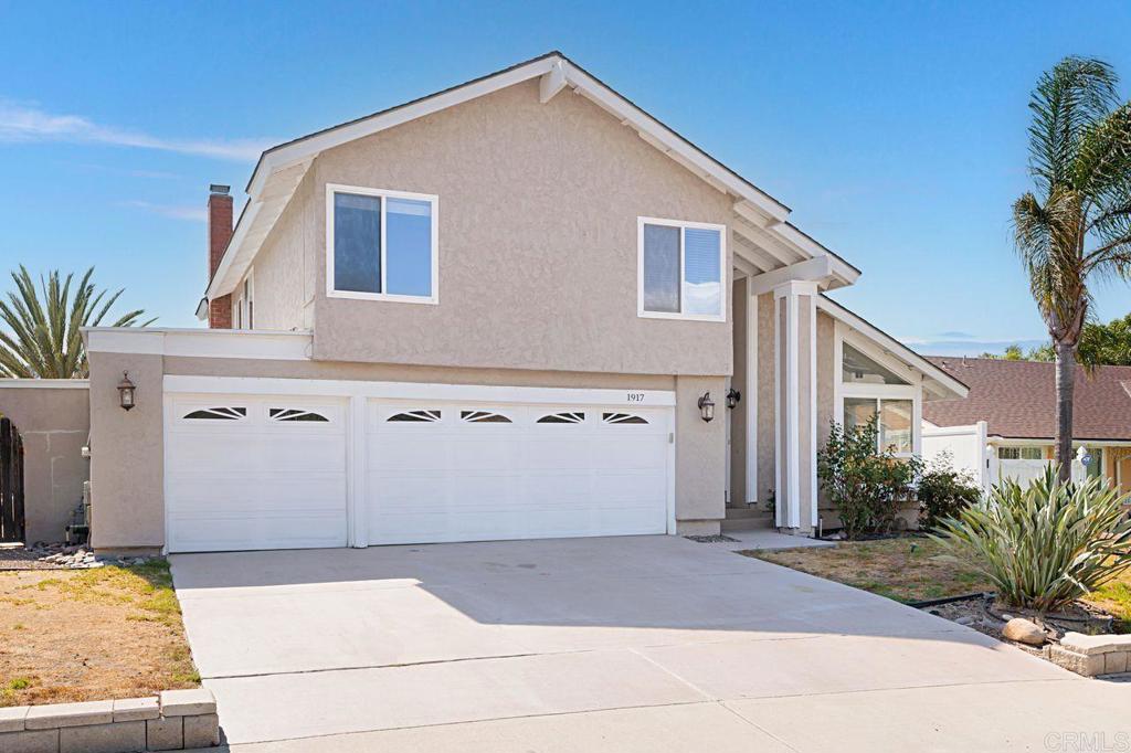 1917 Comanche Street Oceanside, CA 92056 - Photo 1 of 39 a view of a house with a yard