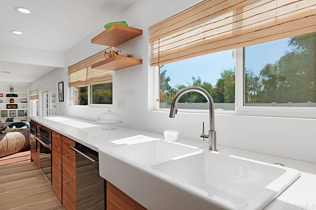 1917 Comanche Street Oceanside, CA 92056 - Photo 13 of 39 a bathroom with a sink and a large mirror