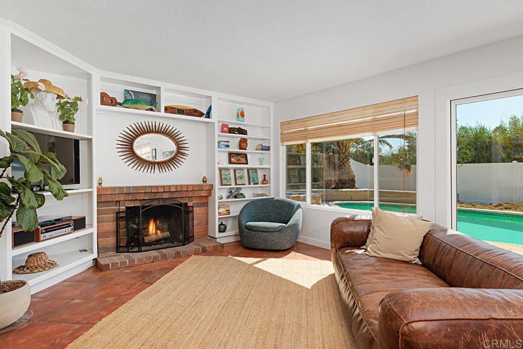 1917 Comanche Street Oceanside, CA 92056 - Photo 15 of 39 a living room with furniture and a fireplace