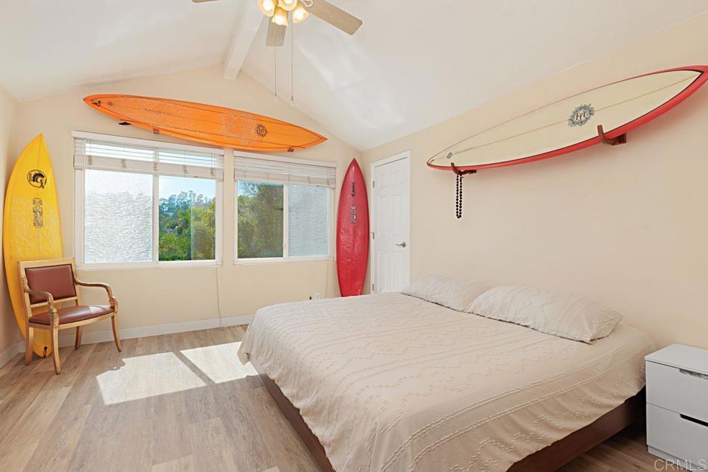 1917 Comanche Street Oceanside, CA 92056 - Photo 19 of 39 a bedroom with a bed and a large window