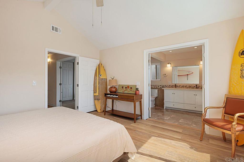 1917 Comanche Street Oceanside, CA 92056 - Photo 20 of 39 a bedroom with a bed and a view of living room