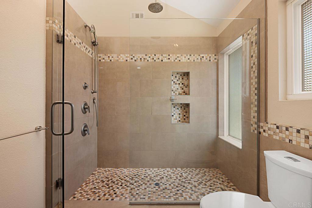 1917 Comanche Street Oceanside, CA 92056 - Photo 22 of 39 a bathroom with a toilet and shower