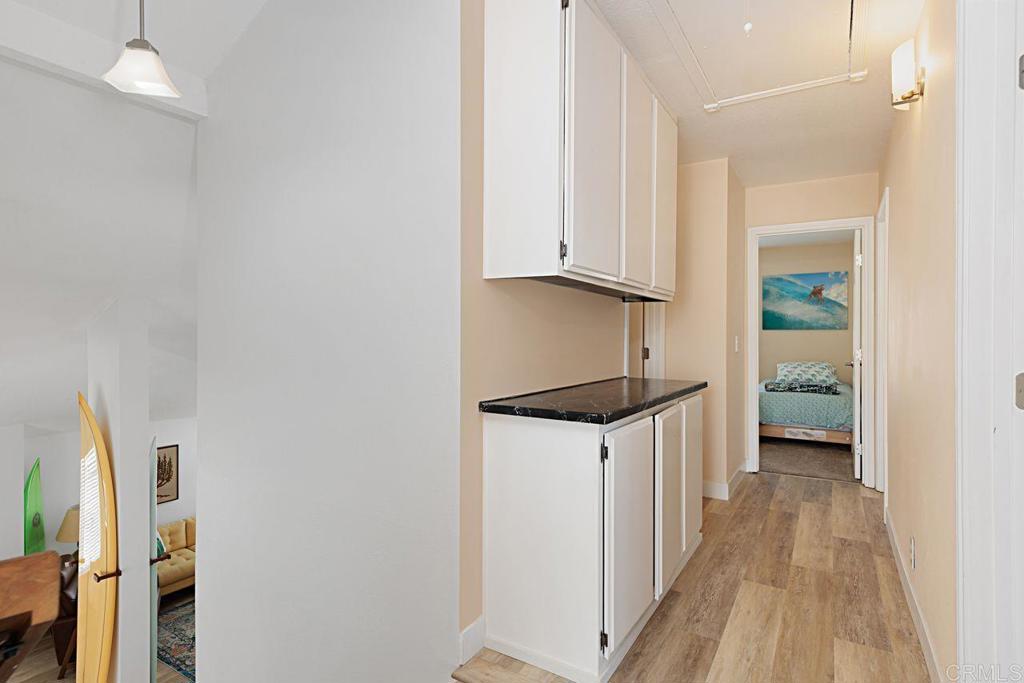 1917 Comanche Street Oceanside, CA 92056 - Photo 23 of 39 a kitchen with granite countertop a sink a stove and a refrigerator