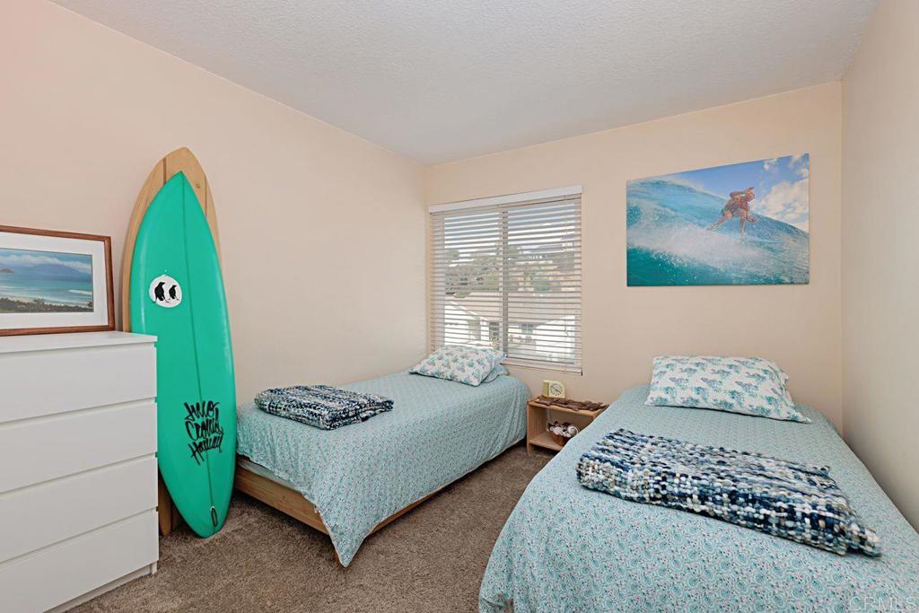 1917 Comanche Street Oceanside, CA 92056 - Photo 27 of 39 a bedroom with a bed and a window