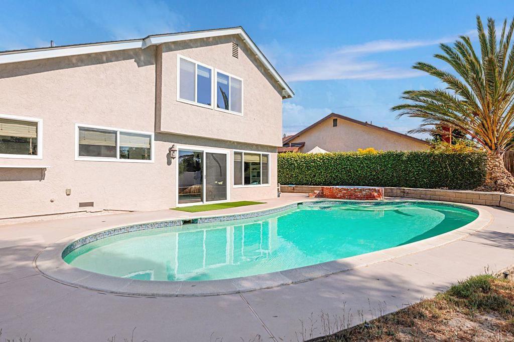 1917 Comanche Street Oceanside, CA 92056 - Photo 32 of 39 a view of a house with a swimming pool and porch