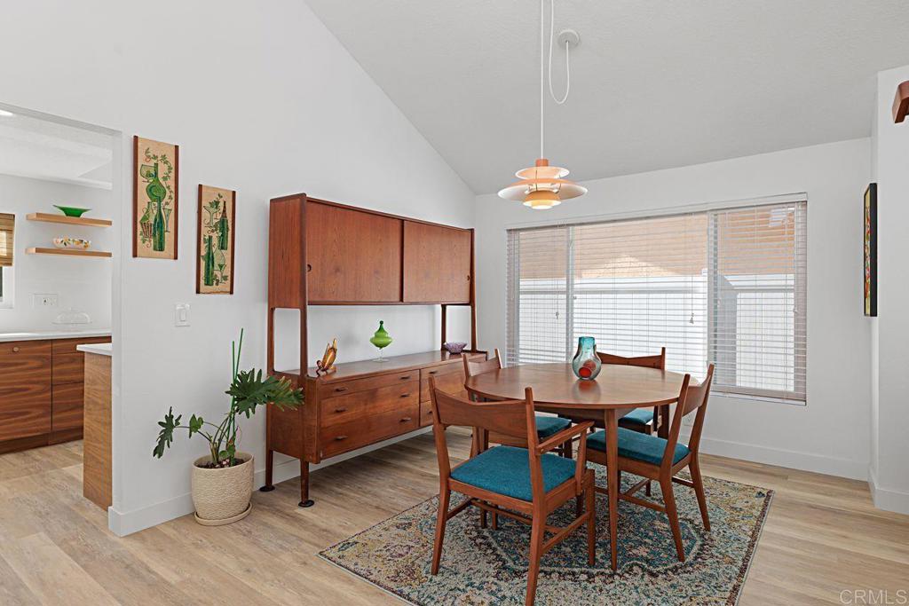 1917 Comanche Street Oceanside, CA 92056 - Photo 8 of 39 a dining room with furniture a chandelier and wooden floor