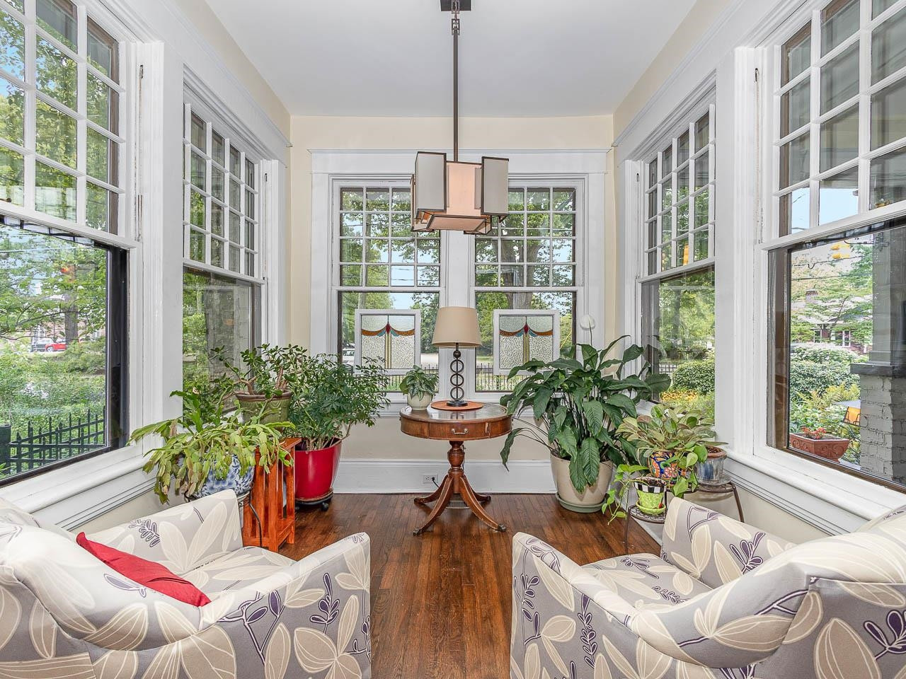 401 West Whitaker Mill Road Raleigh, NC 27608 - Photo 9 of 30 Certain to be a favorite, peaceful spot to watch the neighbors and dogs walking by. New storm windows are double -paned low-E glass for enhanced energy and sound insulation. Sunroom