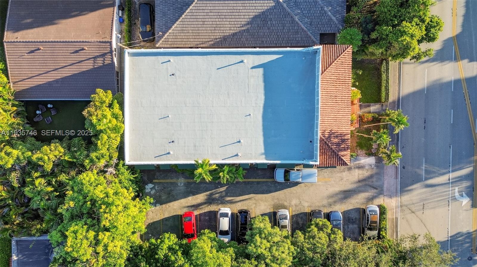 3409 South Le Jeune Road, Unit 5 Coral Gables, FL 33134 - Photo 6 of 14 an aerial view of house with yard and outdoor seating