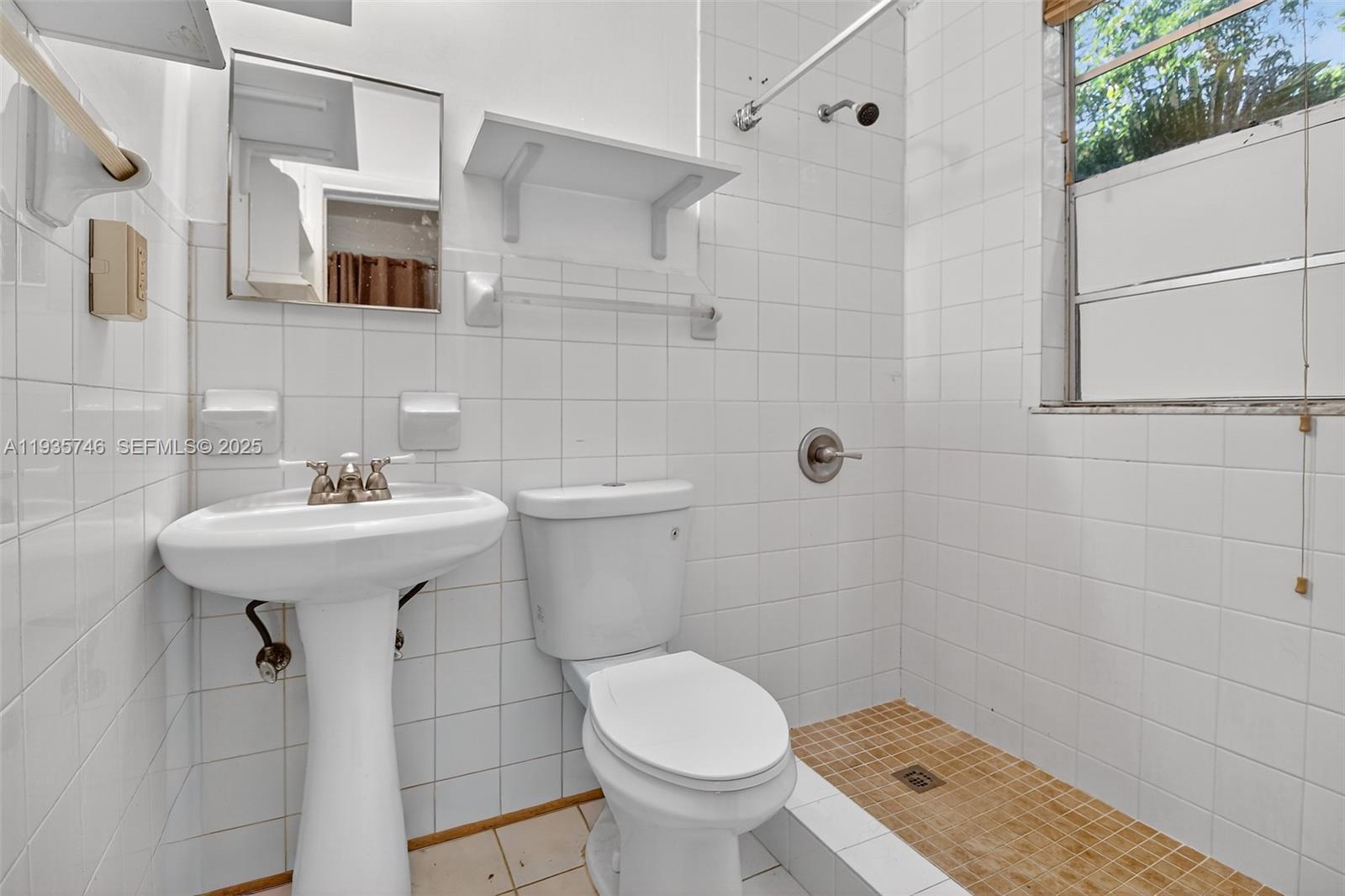 3409 South Le Jeune Road, Unit 5 Coral Gables, FL 33134 - Photo 8 of 14 a bathroom with a sink toilet and shower