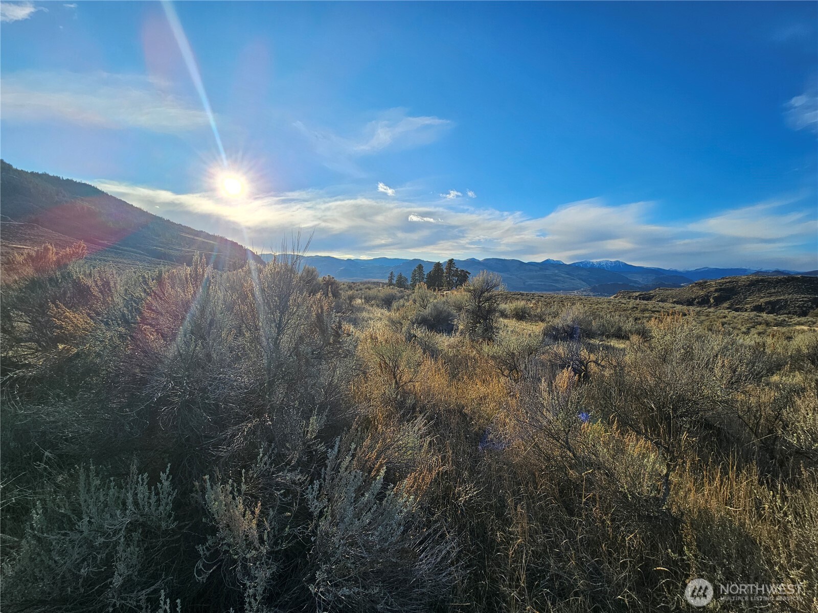 21 Pine Grove Road, Unit LOT 47 Oroville, WA 98844 - Photo 9 of 29 a view of a city and mountains in the background
