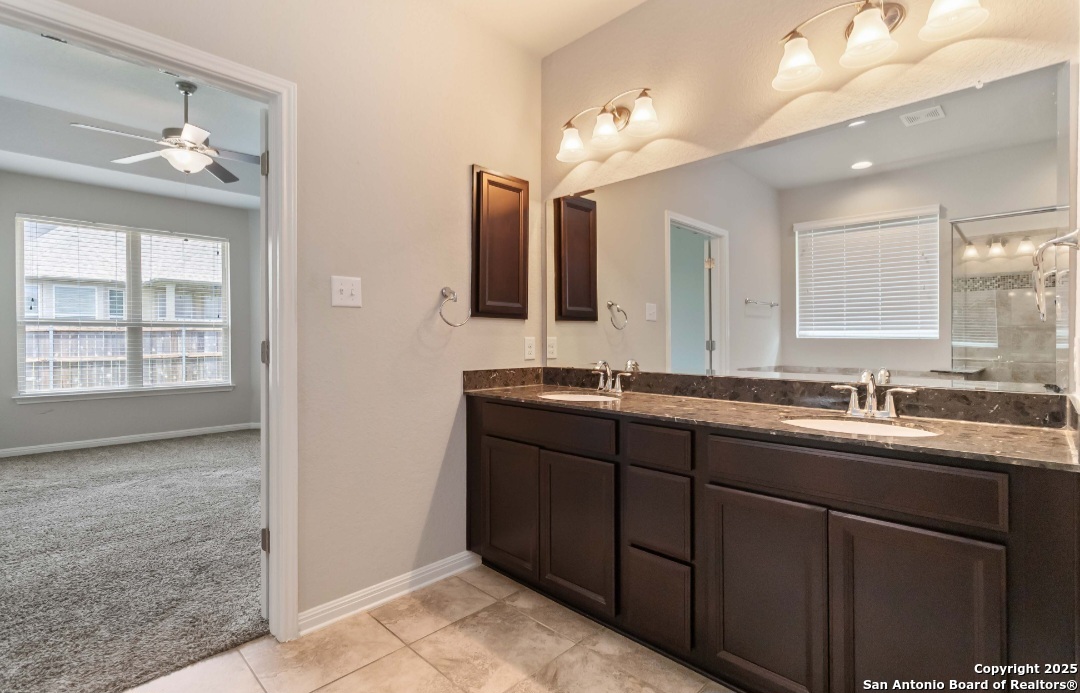 629 Cavan Cibolo, TX 78108 - Photo 12 of 20 a bathroom with double sink and a mirror