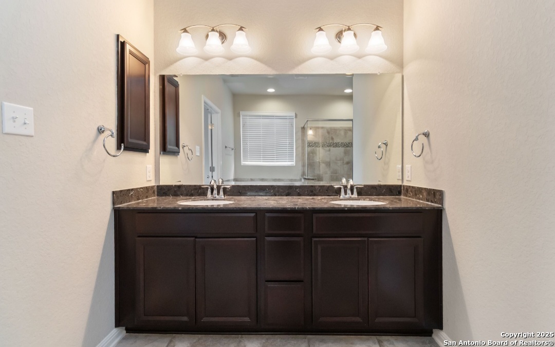 629 Cavan Cibolo, TX 78108 - Photo 13 of 20 a bathroom with a sink vanity and a mirror
