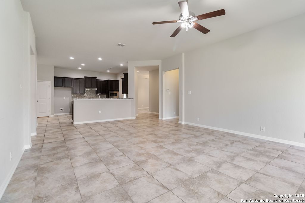 629 Cavan Cibolo, TX 78108 - Photo 2 of 20 a view of a kitchen with a sink and a chandelier fan