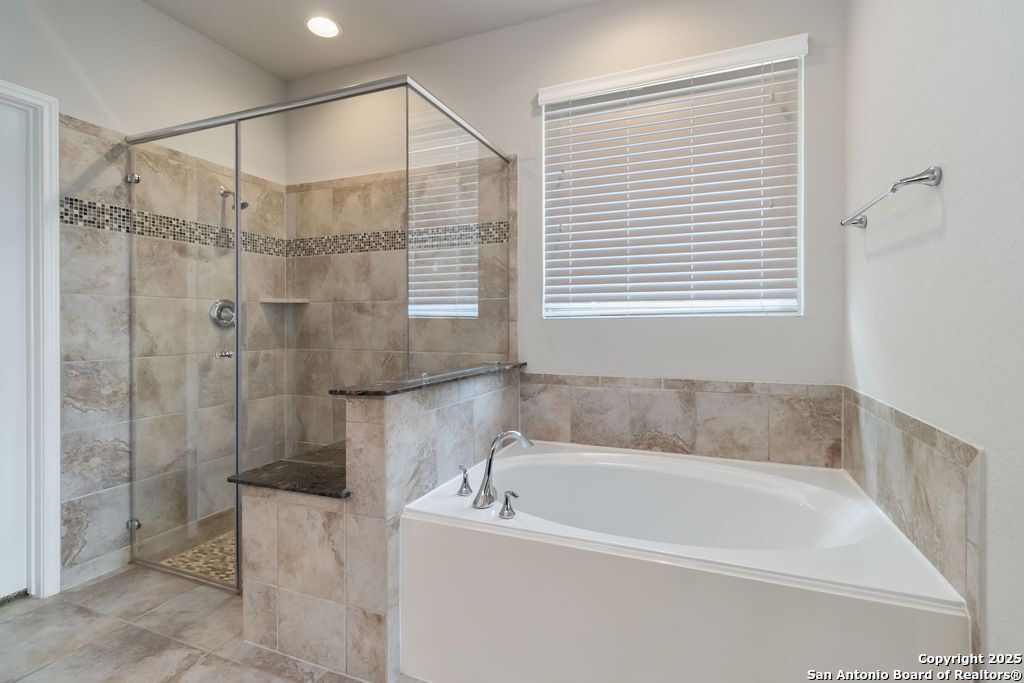 629 Cavan Cibolo, TX 78108 - Photo 6 of 20 a white bath tub sitting next to a shower