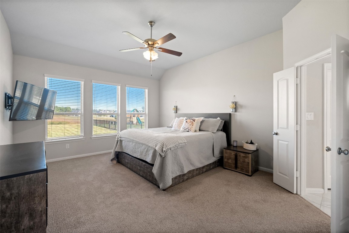 225 Peninsula Point Drive Montgomery, TX 77356 - Photo 11 of 38 a spacious bedroom with a bed and window
