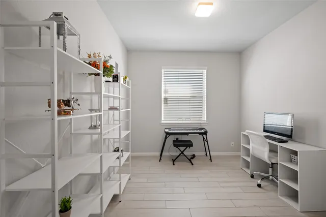 a view of a livingroom with furniture and staircase