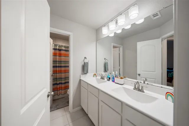 a bathroom with a sink a vanity and a mirror