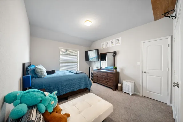 a bedroom with furniture and a bed