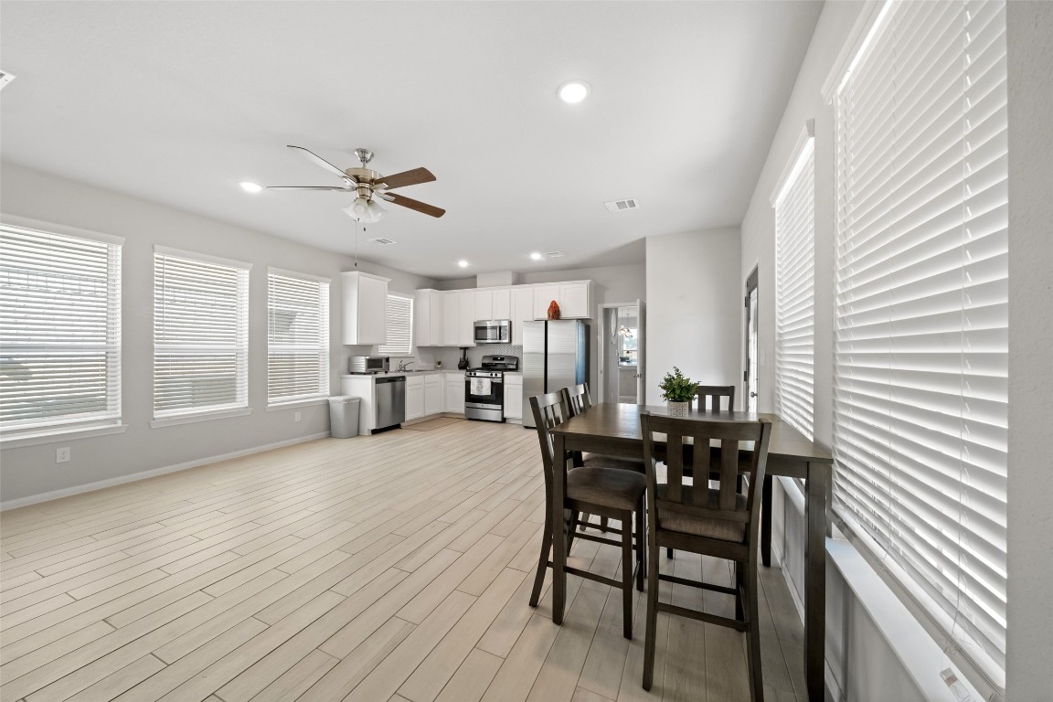 225 Peninsula Point Drive Montgomery, TX 77356 - Photo 29 of 38 a view of a dining room with furniture and a large window