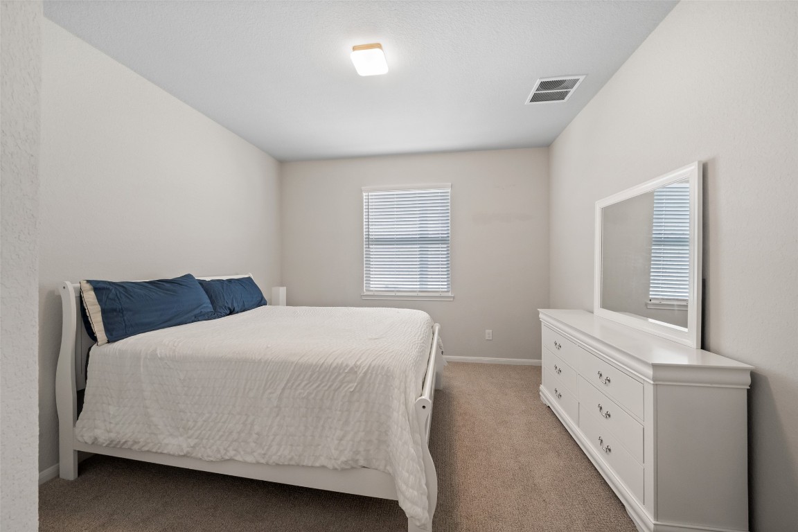 225 Peninsula Point Drive Montgomery, TX 77356 - Photo 30 of 38 a bedroom with a bed and a window