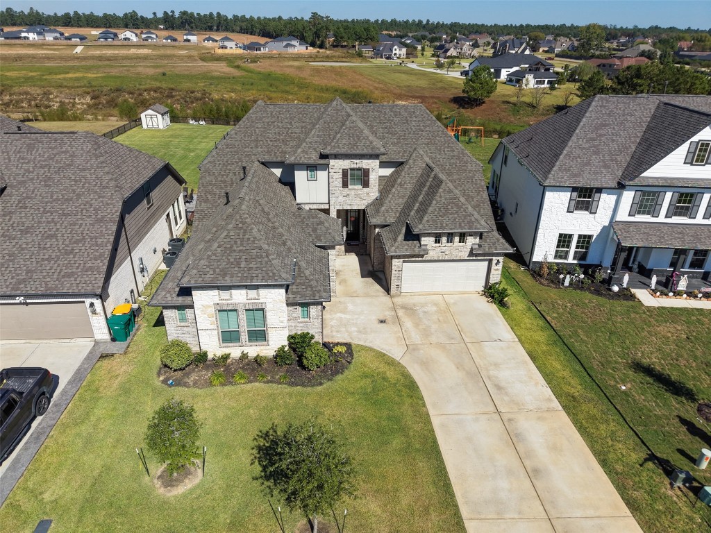 225 Peninsula Point Drive Montgomery, TX 77356 - Photo 32 of 38 a aerial view of a house with a ocean view