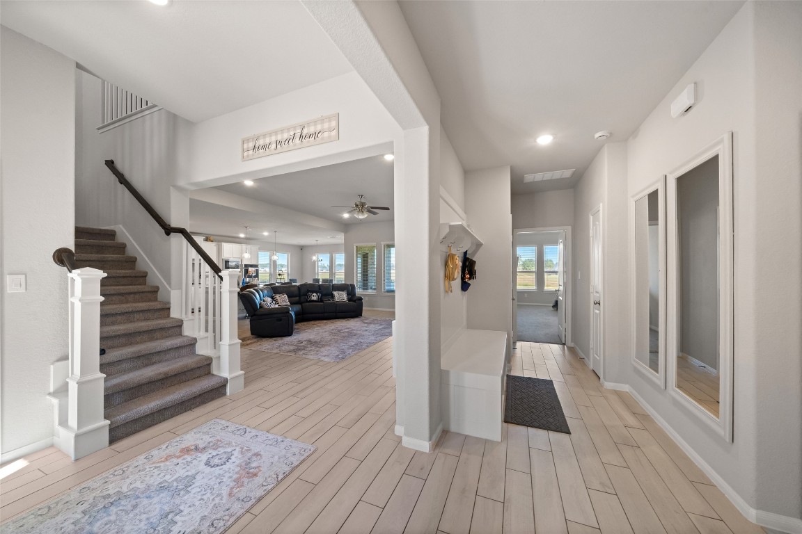 225 Peninsula Point Drive Montgomery, TX 77356 - Photo 4 of 38 a view of a hallway with wooden floor and staircase