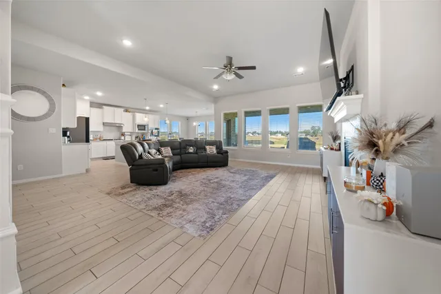 a living room with furniture a table and chairs