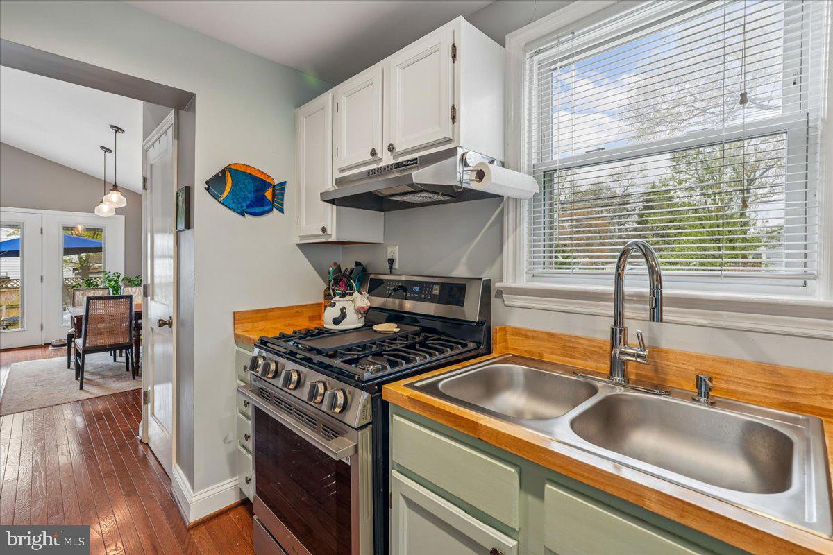 4801 Nicholson Street Riverdale, MD 20737 - Photo 15 of 39 a kitchen with stainless steel appliances granite countertop a sink stove and cabinets