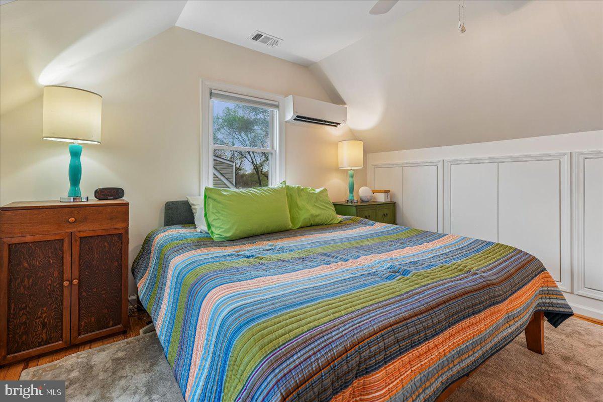 4801 Nicholson Street Riverdale, MD 20737 - Photo 22 of 39 a bedroom with a bed and a lamp