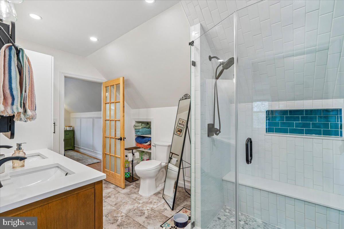 4801 Nicholson Street Riverdale, MD 20737 - Photo 27 of 39 a bathroom with a tub sink toilet and mirror