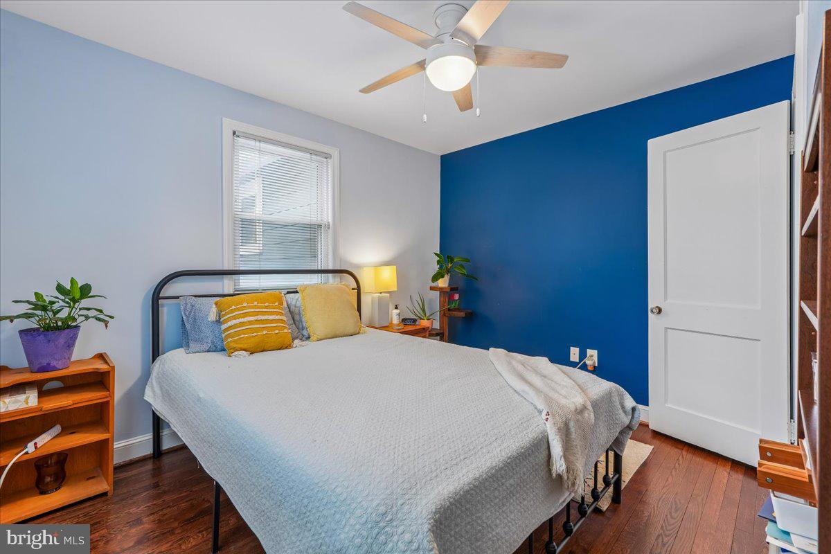 4801 Nicholson Street Riverdale, MD 20737 - Photo 29 of 39 a bedroom with a bed and wooden floor