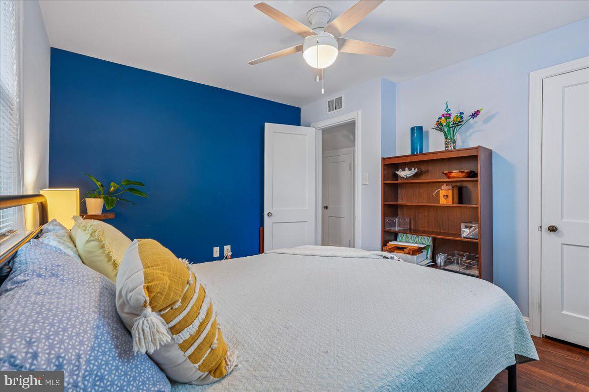4801 Nicholson Street Riverdale, MD 20737 - Photo 30 of 39 a bedroom with a bed and a chandelier