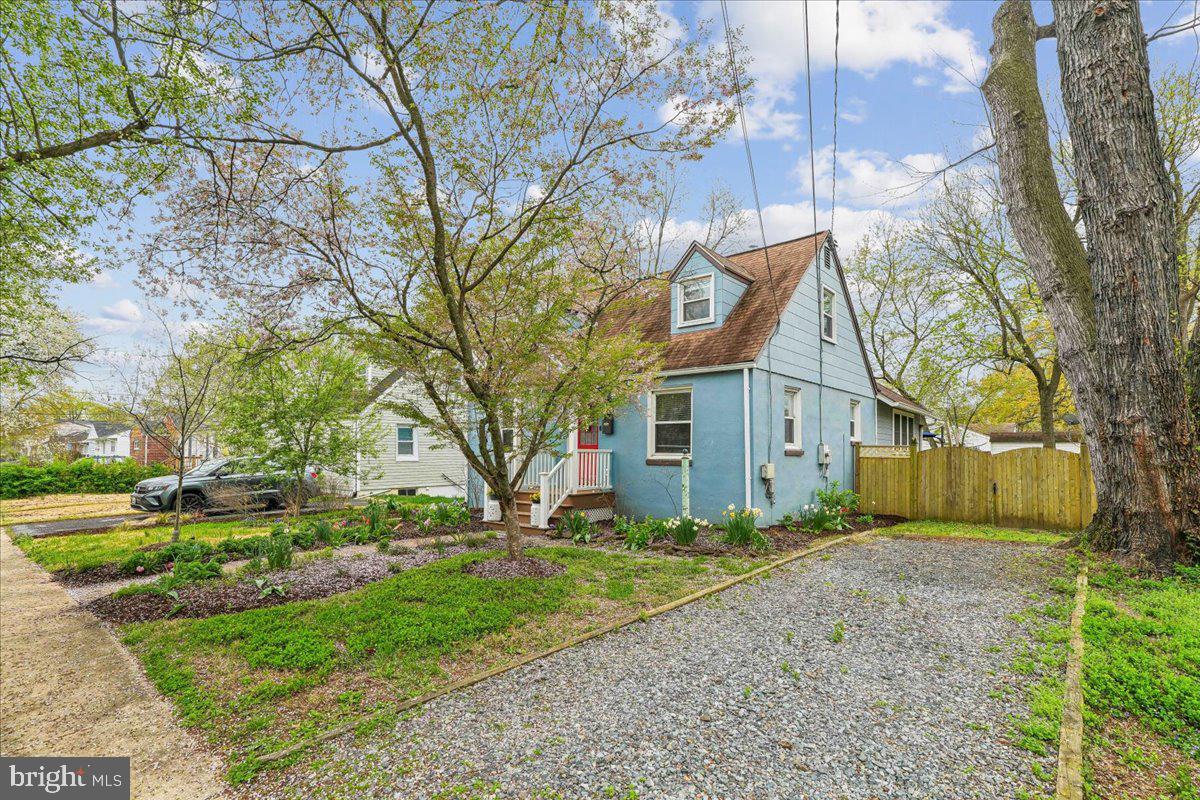 4801 Nicholson Street Riverdale, MD 20737 - Photo 3 of 39 a view of a house with a large tree in front of it