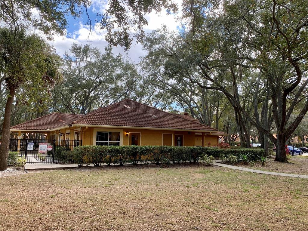 5263 Images Circle, Unit 106 Kissimmee, FL 34746 - Photo 11 of 17 a front view of a house with a yard