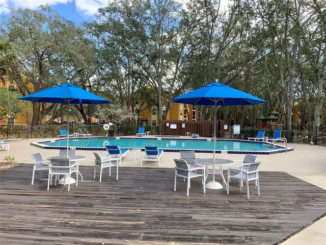 a patio with a patio table and chairs