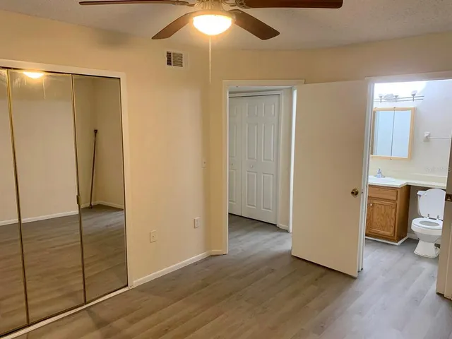 a view of a bathroom with wooden floor