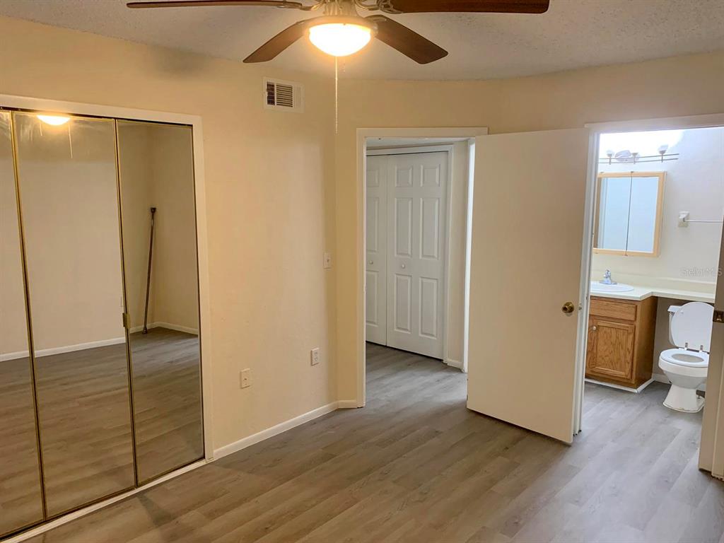 5263 Images Circle, Unit 106 Kissimmee, FL 34746 - Photo 7 of 17 a view of a bathroom with wooden floor