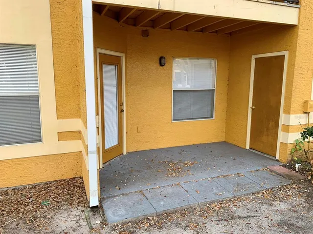 a view of a house with a small yard