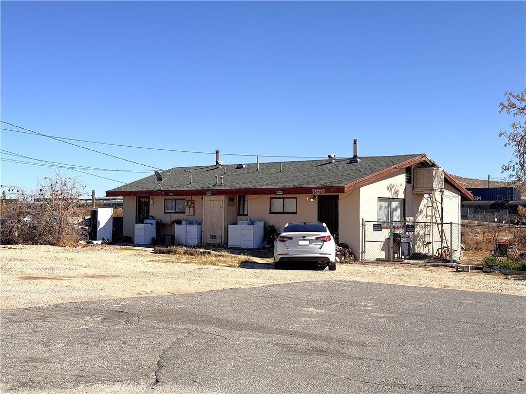 25617 Jasper Road Barstow, CA 92311 - Photo 3 of 6 a car parked in front of a building