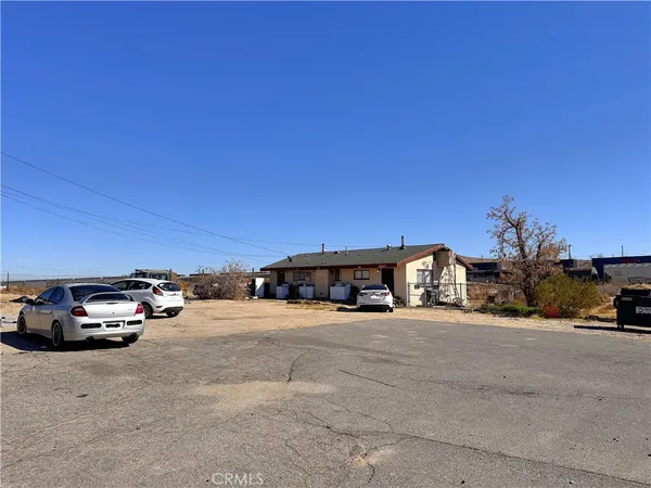 a view of car parked in front of a house