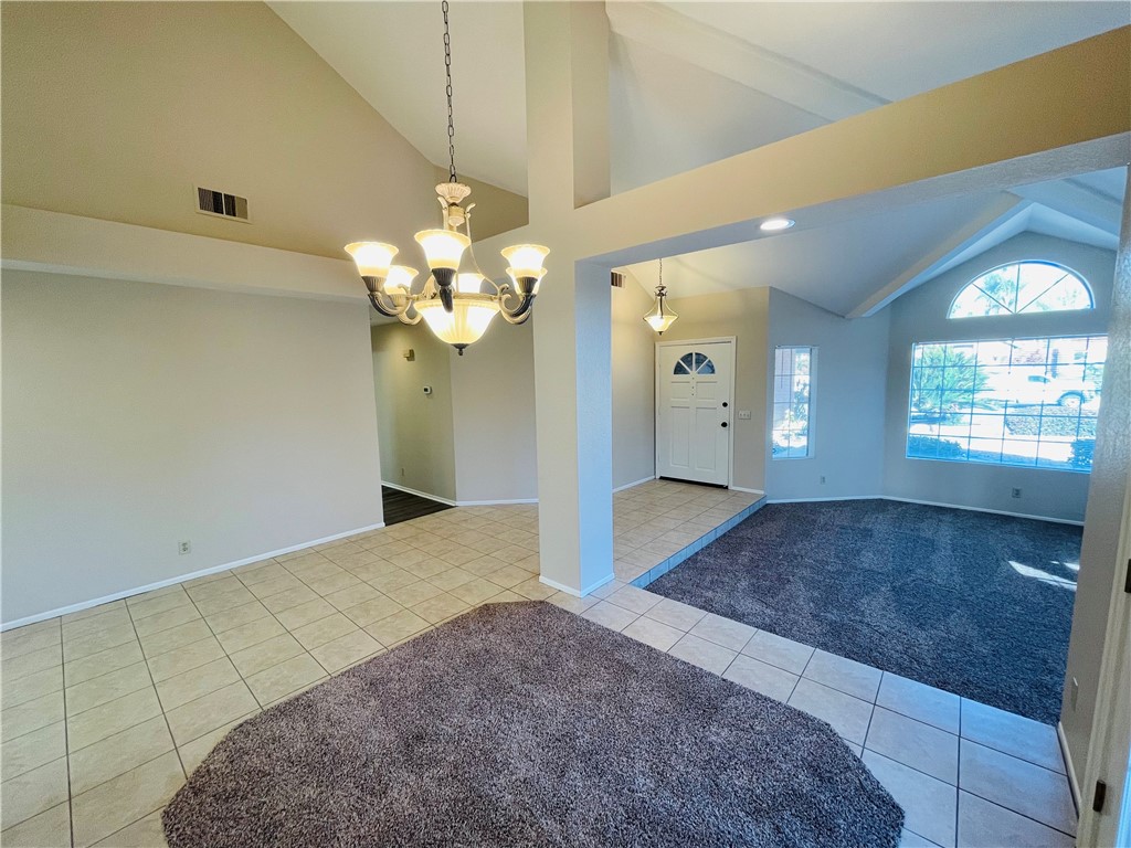 41915 Avenida Sonoma Temecula, CA 92591 - Photo 12 of 60 a view of livingroom with entryway and chandelier fan