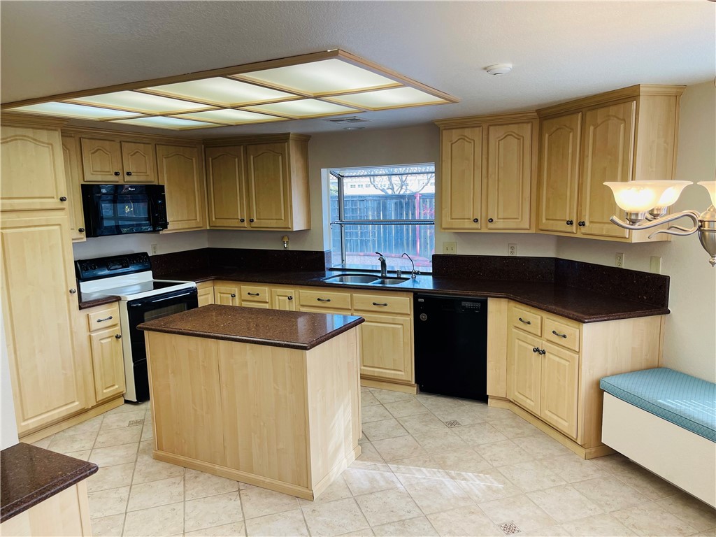 41915 Avenida Sonoma Temecula, CA 92591 - Photo 23 of 60 a kitchen with stainless steel appliances granite countertop a stove a sink and a refrigerator