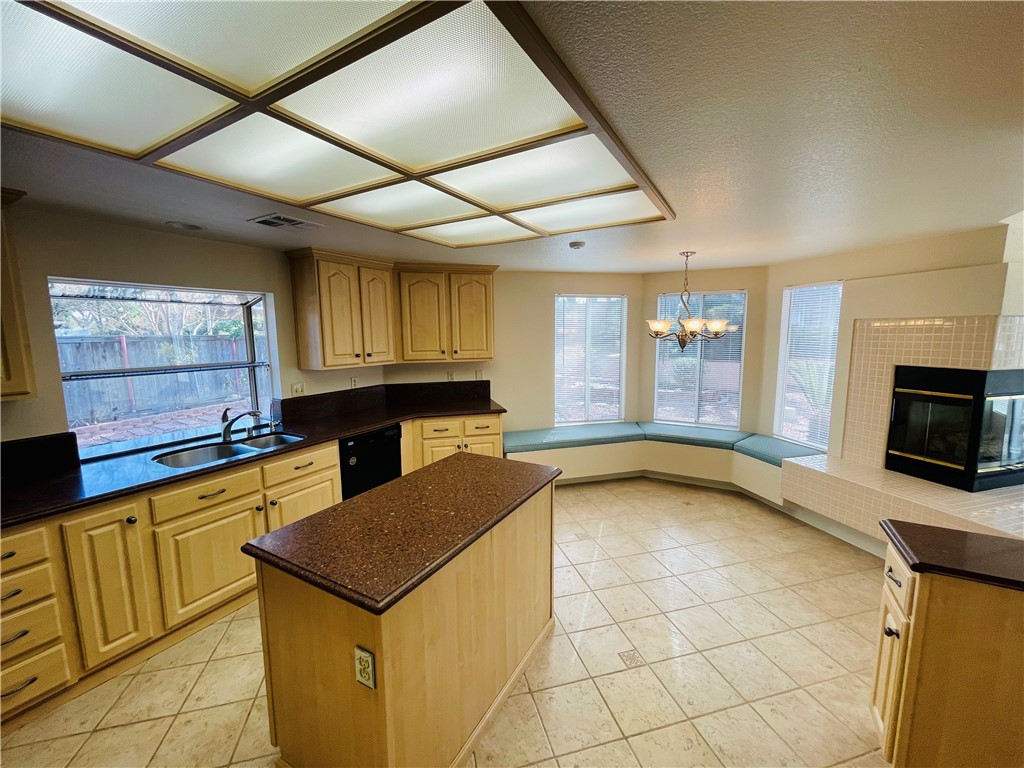 41915 Avenida Sonoma Temecula, CA 92591 - Photo 24 of 60 a kitchen with a stove a sink and a microwave