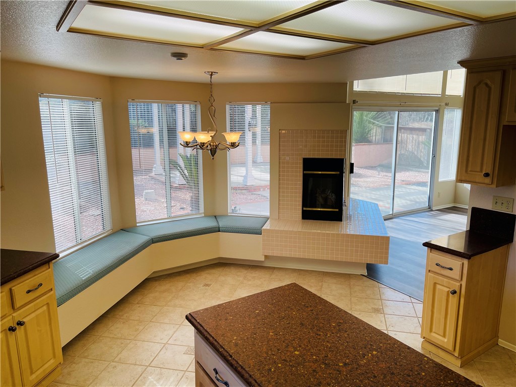 41915 Avenida Sonoma Temecula, CA 92591 - Photo 26 of 60 a view of a kitchen with a sink and a fireplace