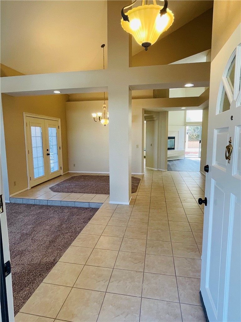 41915 Avenida Sonoma Temecula, CA 92591 - Photo 6 of 60 a view of a hallway with wooden floor and a bathroom