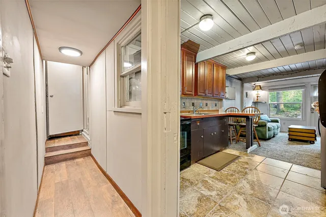 a view of kitchen with furniture and a refrigerator