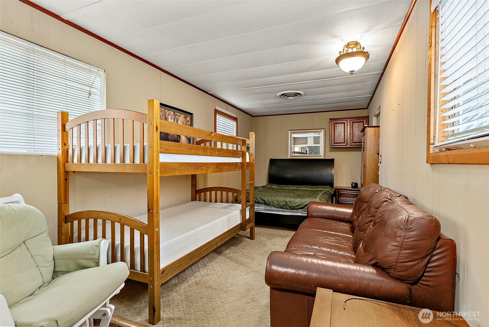 270 Skate Creek Road North Ashford, WA 98304 - Photo 18 of 36 a living room with furniture and a flat screen tv